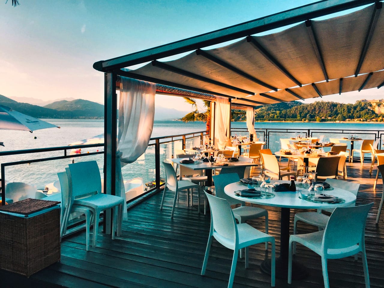 A dining room mid-service, every table occupied