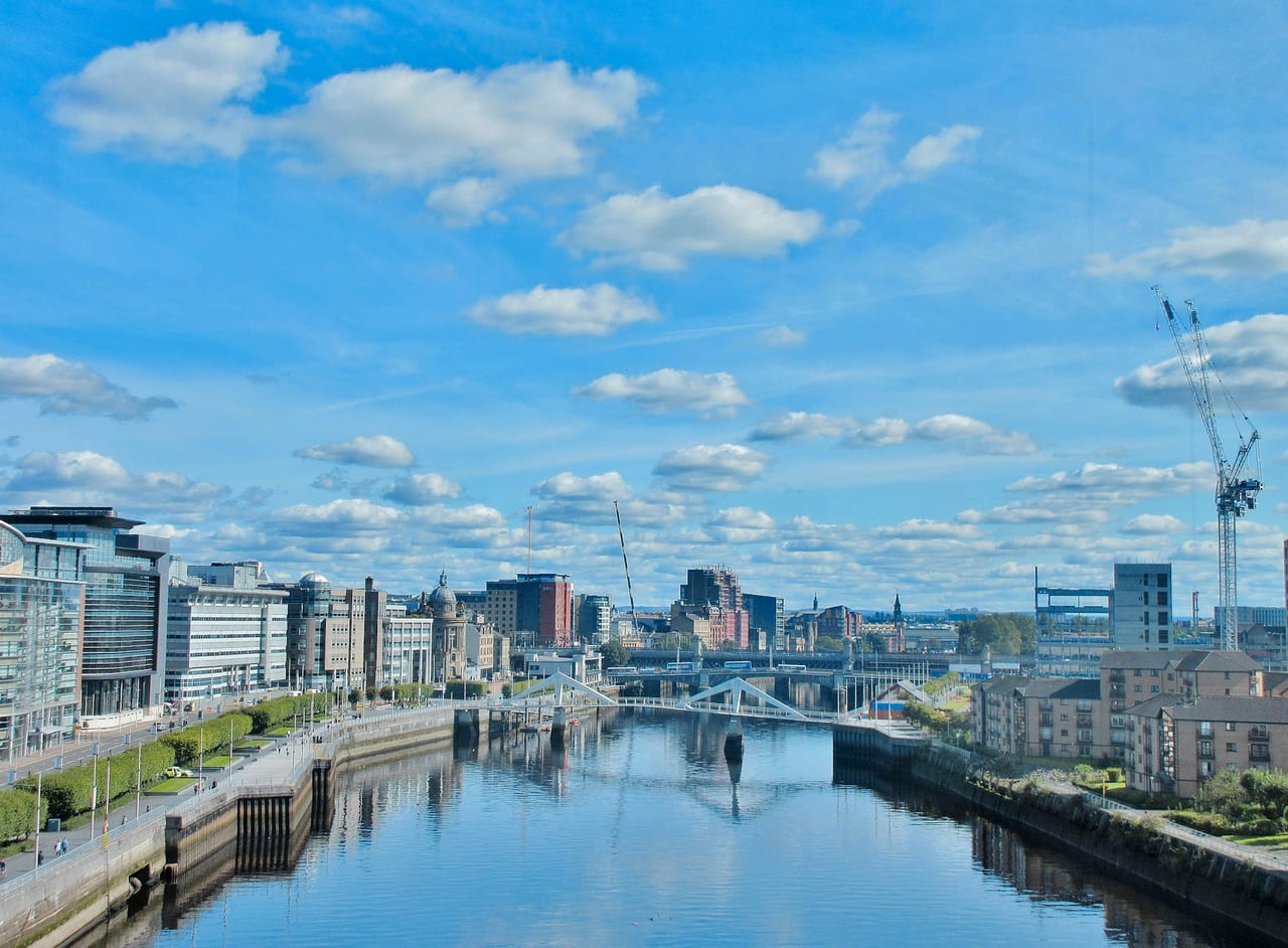 Glasgow along the River Clyde on a bright day, bridges leading into the city